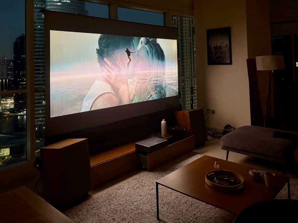 Cinema at home. 100" projector. UST tech. Sofa dive read