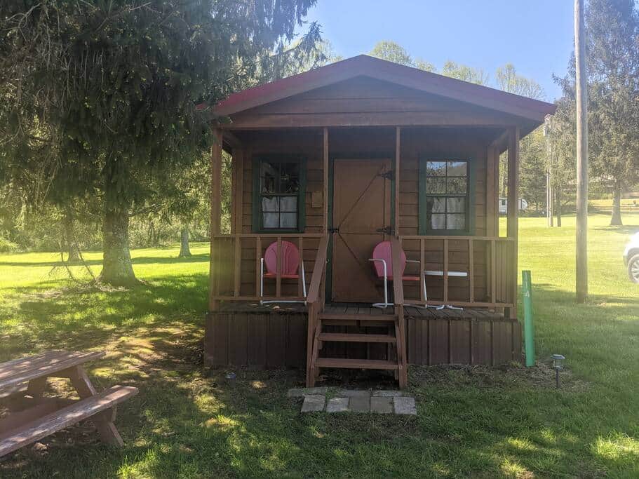 A front porch with 2 chairs.
