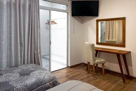 Room 2, TV, Work Desk, Hangers: Room includes a flat-screen TV, work desk and hangers