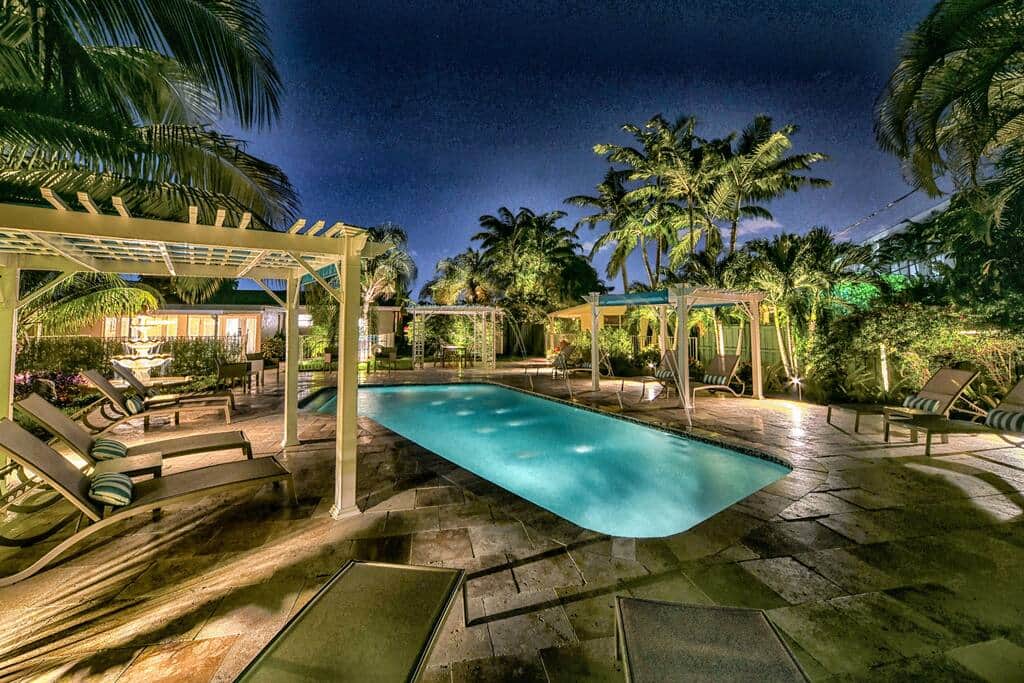 Pool and Tropical Palms and Gardens are lighted at night.