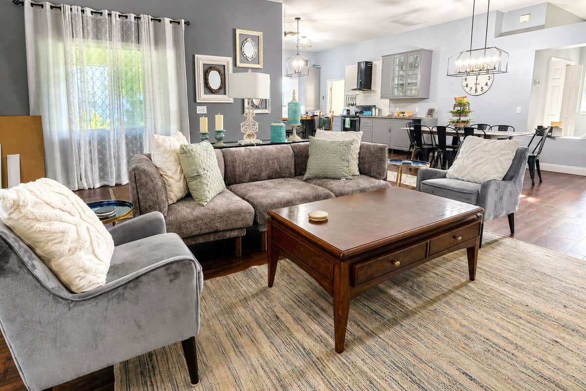 Plenty of comfortable seating, a large coffee table, beautiful wood flooring, and an open layout, this is truly the heart of the home—a wonderful place to relax, entertain, play games, watch TV, or simply enjoy time together.