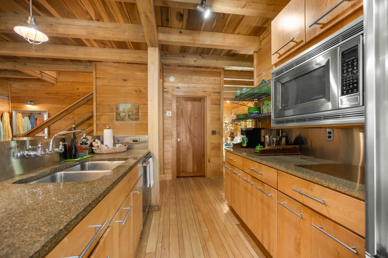 Kitchen Granite Counters built in microwave custom stainless backsplashes.