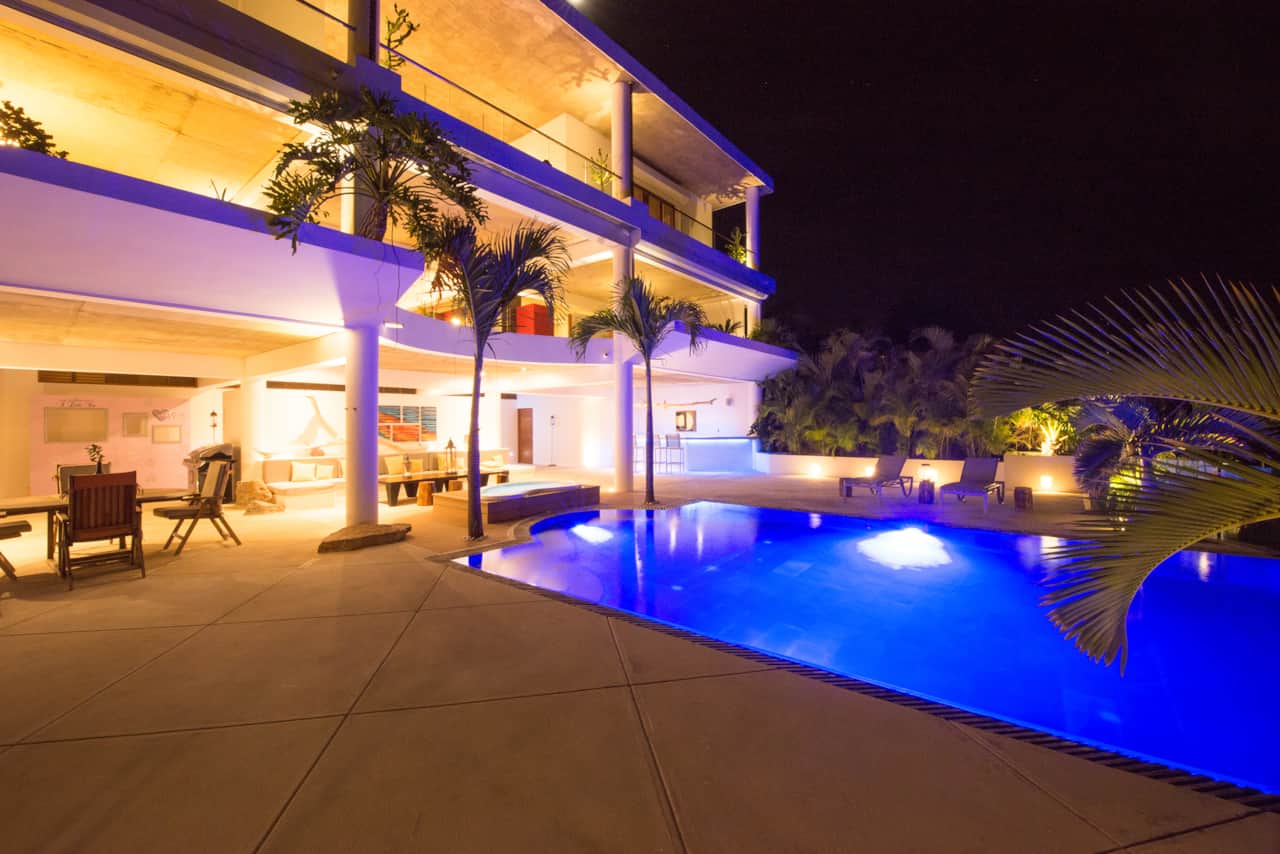 Infinity pool illuminated at night in Las Terrenas
