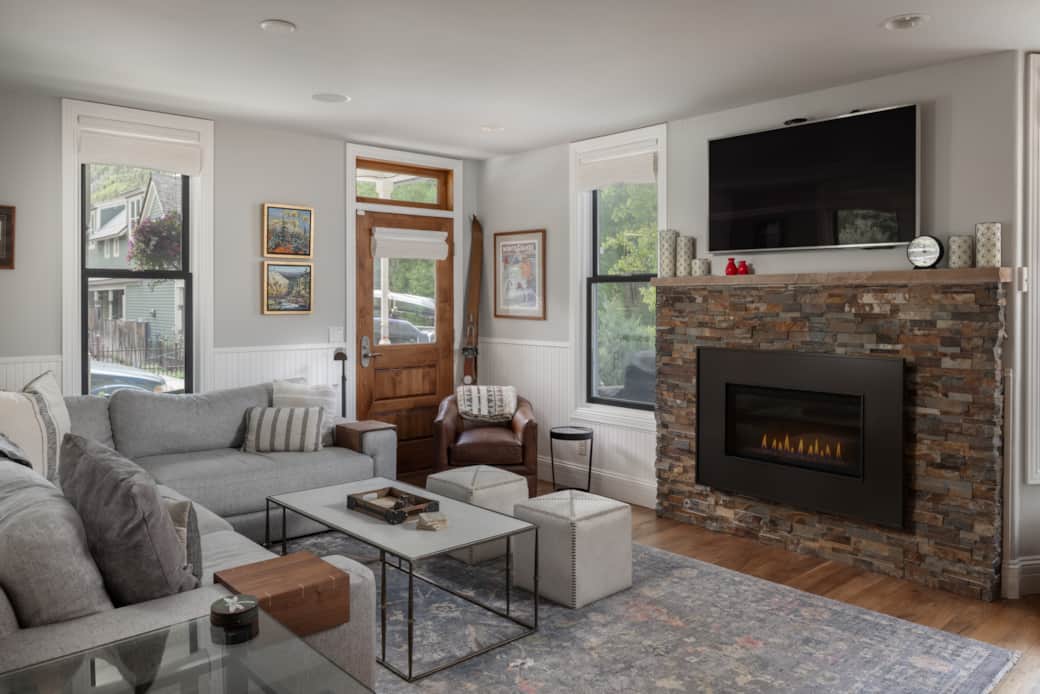 Spacious and relaxing main level seating with TV and gas fireplace