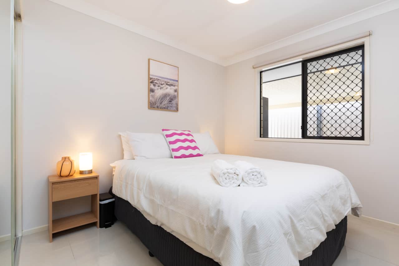 Bedroom: Peaceful bedroom with cozy design and ample storage