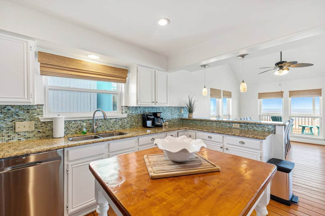 Kitchen opens to dining and family room as well as ocean view. Kitchen opens to dining and family room as well as ocean view.