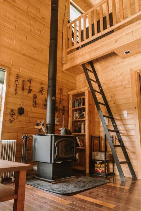 Note that the queen bed is accessed by a ladder to its loft.