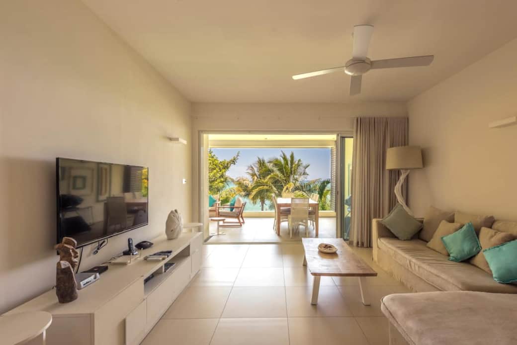 Living room overlooking balcony and view on the lagoon Living room overlooking balcony and view on the lagoon