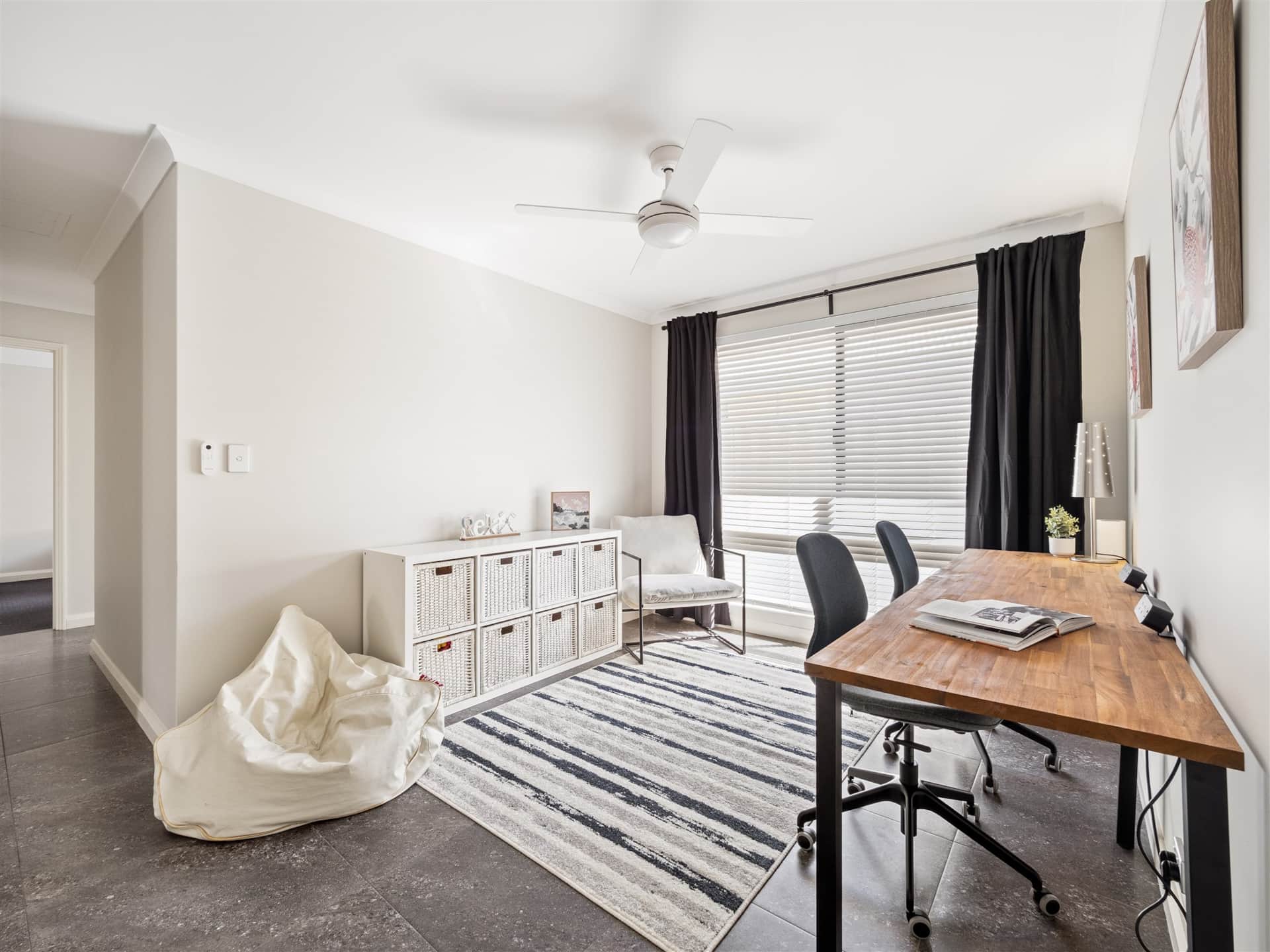 Sun filled games room with kids toys plus dedicated workspace