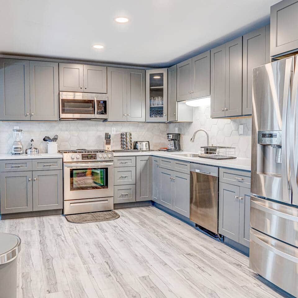 Kitchen: Culinary adventures await in this stylish, fully-equipped kitchen with sleek gray cabinets.