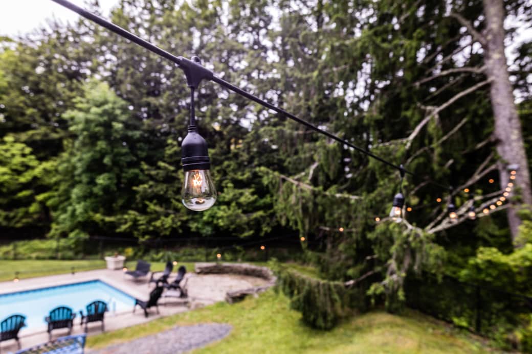 Outdoor string lights line the entire yard Outdoor string lights line the entire yard