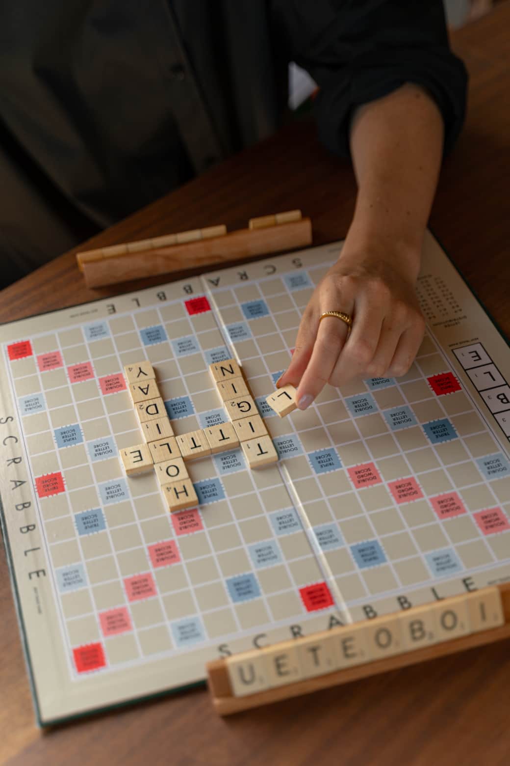 Rainy day scrabble board game cosy cabin table