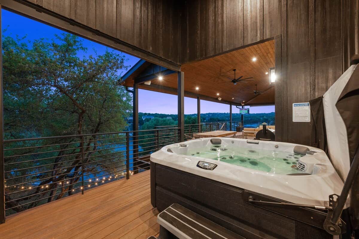 Soak in the hot tub while taking in peaceful Lake Travis views