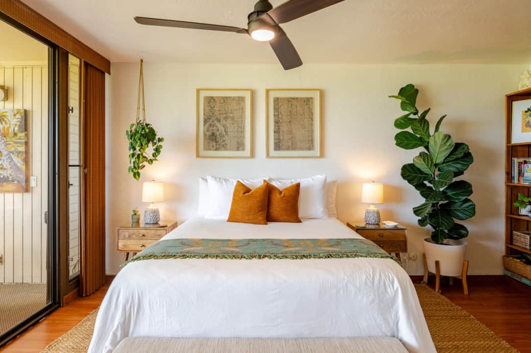 Comfortable queen bed with soft linens, perfect for a restful night’s sleep.