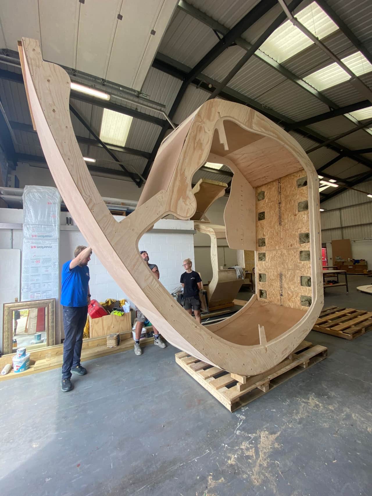 Monocoque Cabin — The cabin under construction. Curved laminated plywood ribs assembled by hand in the workshop.