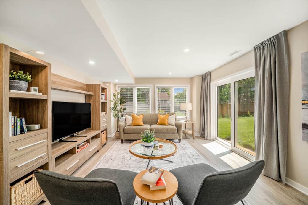 Relax in this cozy living room, styled with a comfy couch, two chairs, and a 47" smart TV. Relax in this cozy living room, styled with a comfy couch, two chairs, and a 47" smart TV.