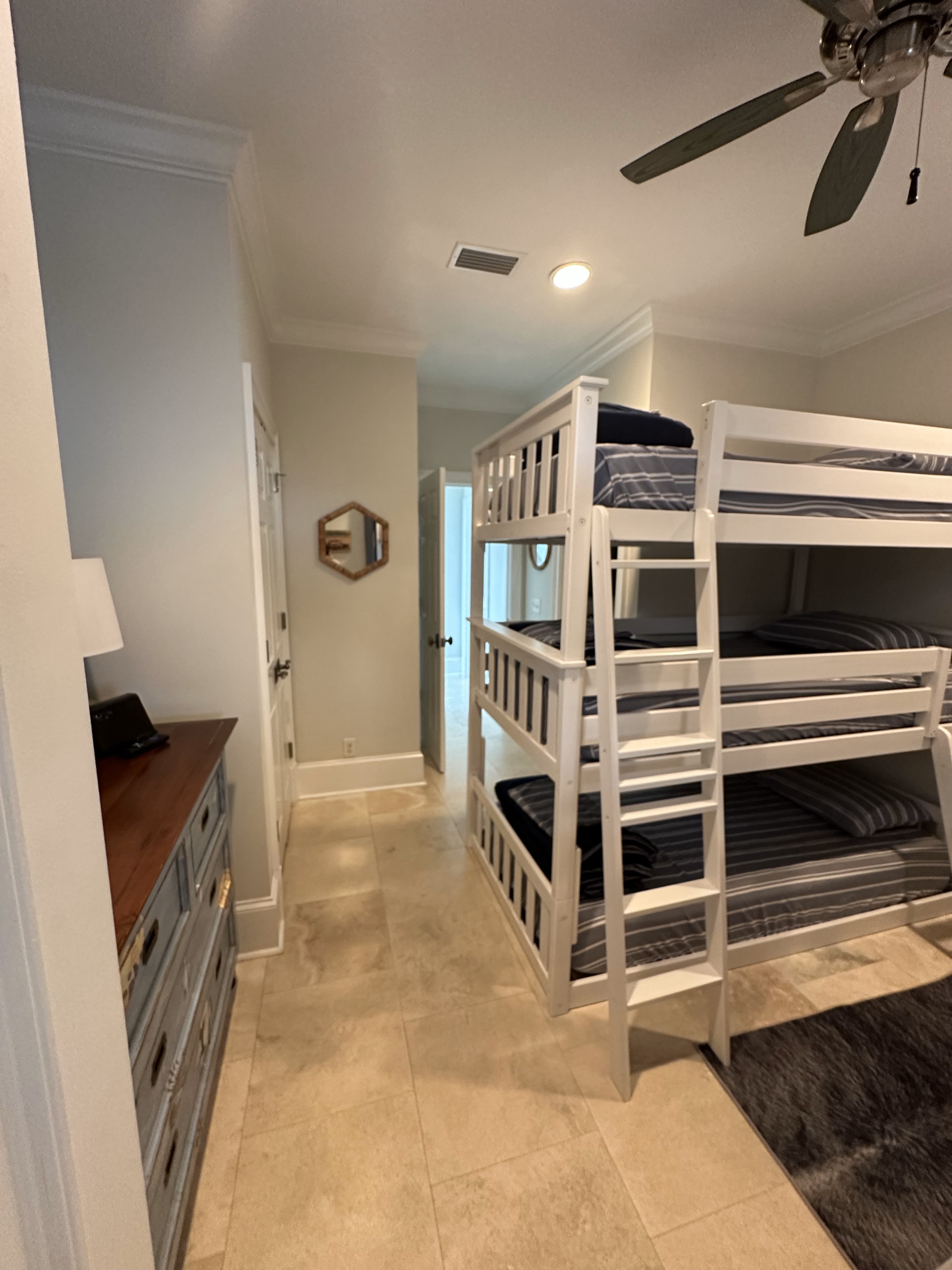 Fourth floor bedroom with two twin triple bunk beds, tv and ensuite.