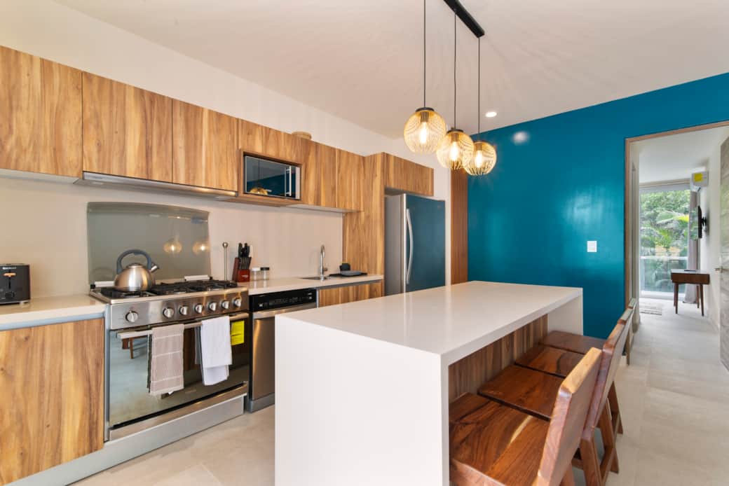 Well-equipped kitchen with dishwasher, blender, coffee maker & 6-burner stove.
