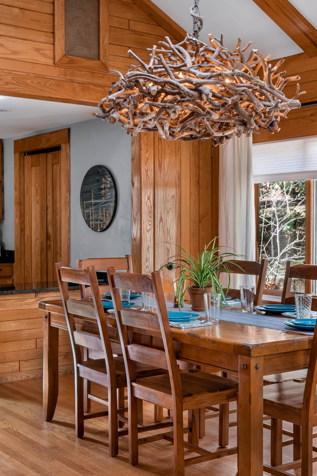 Dining table seats six.Perfect for meals, games, or planning fun with forest views and natural light