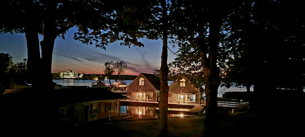 Harbor House and Lighthouse at night