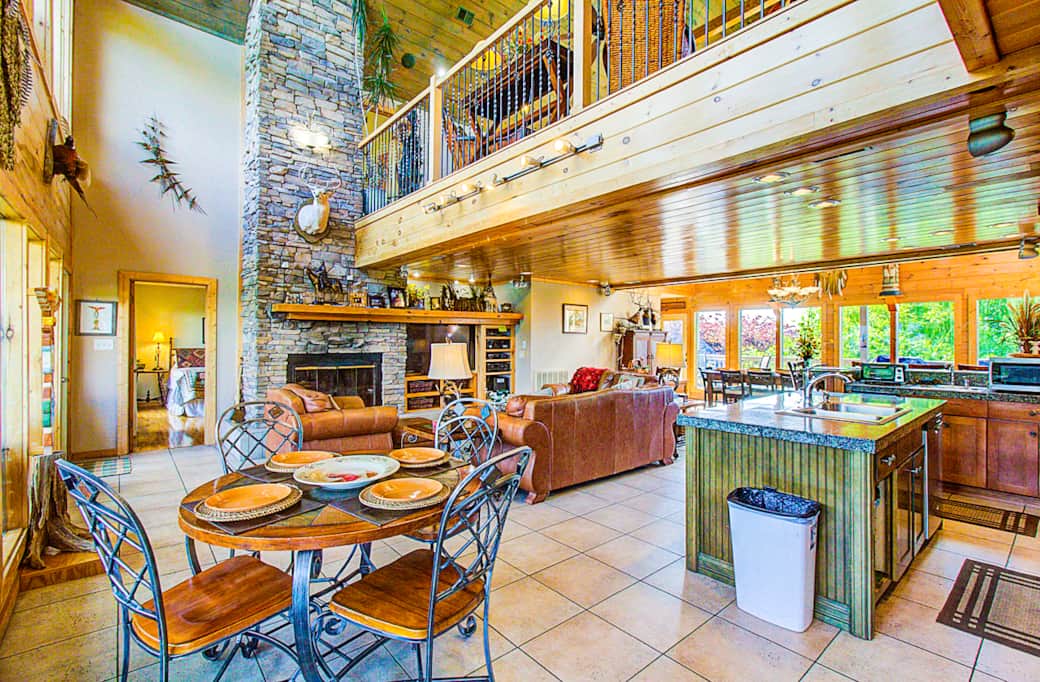 Great Room breakfast/game table, living area, and gourmet kitchen. Great Room breakfast/game table, living area, and gourmet kitchen.