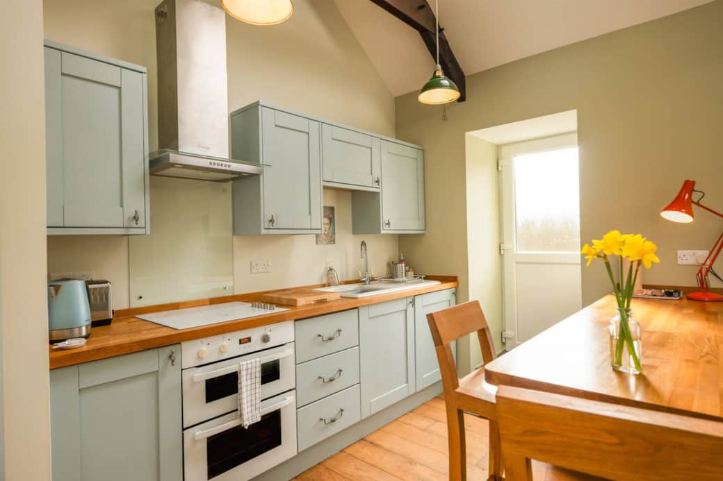 Kitchen with back door leading to the patio.