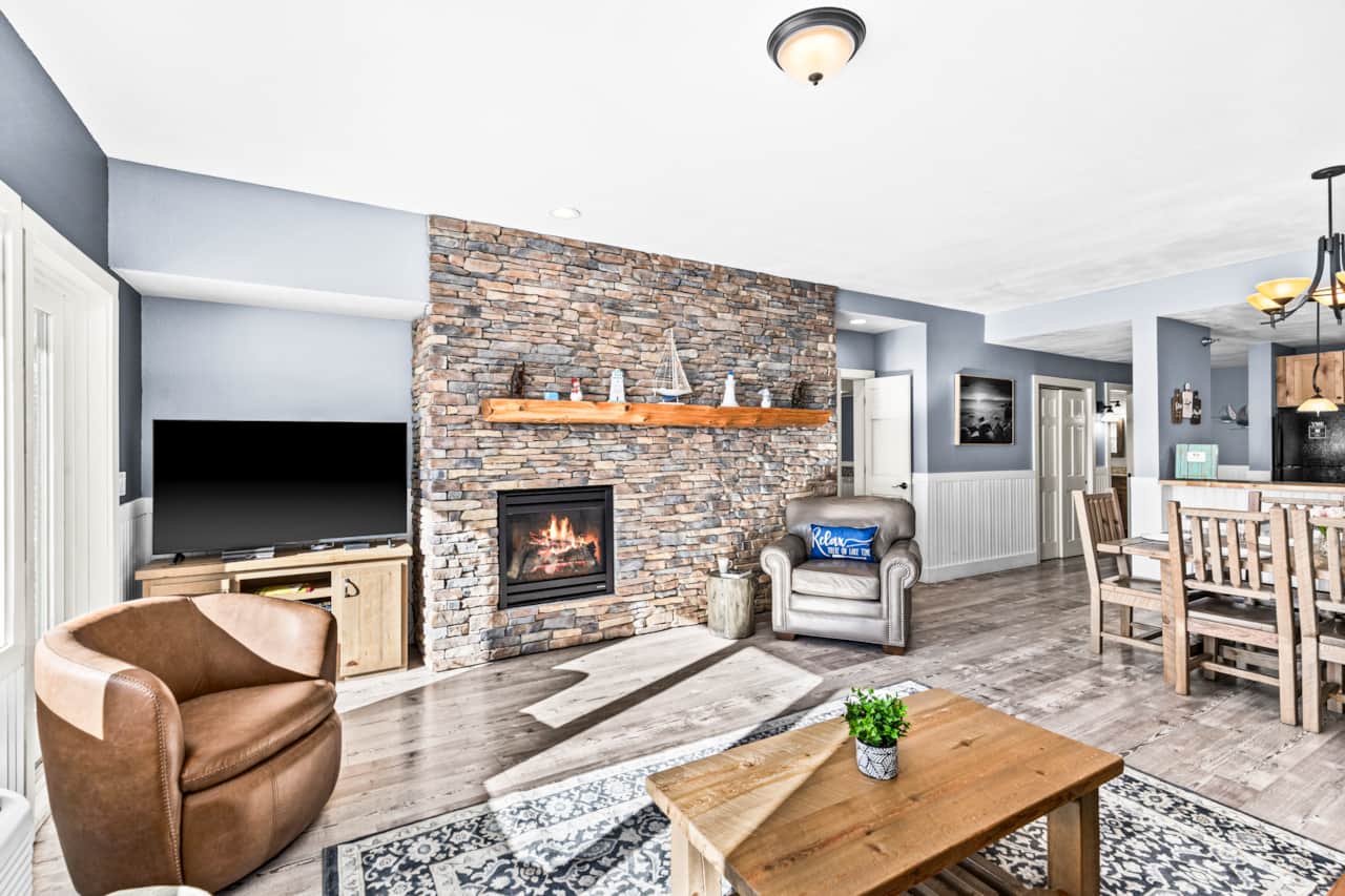 Warm fireplace, comfy sofa, perfect living room vibes.