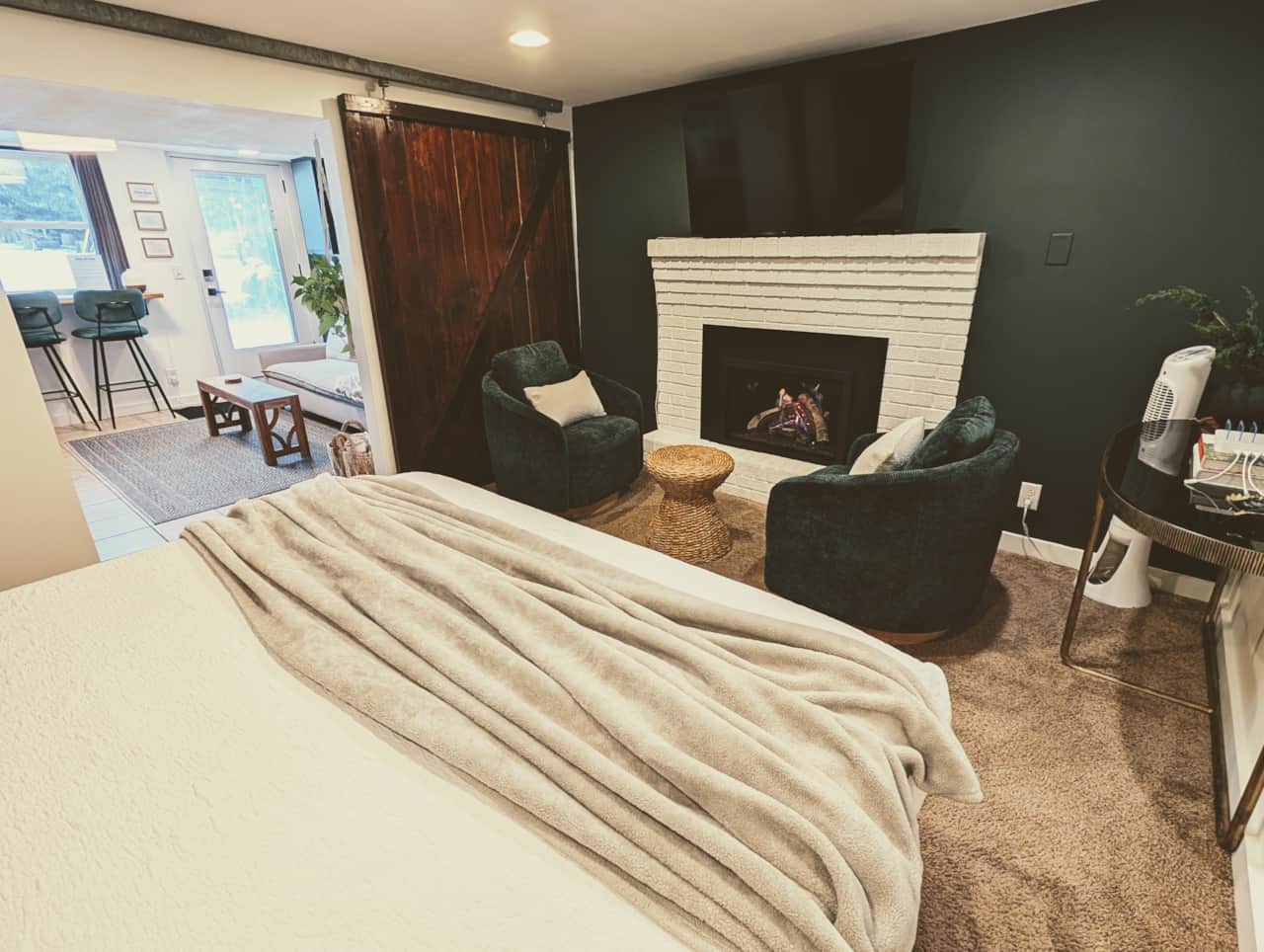 Enjoy watching a movie and other amenities including a fan,  cozy reading spot and charging station