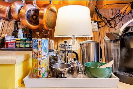 Coffee and tea station with bean grinders, French press, pour over, Keurig, and electric kettle. Coffee and tea station with bean grinders, French press, pour over, Keurig, and electric kettle.