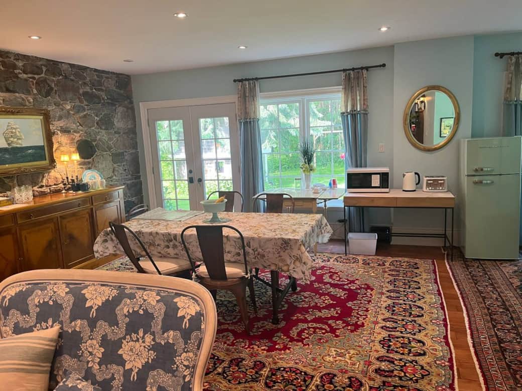 Breakfast area overlooking patio. Continental Breakfast provided. Full house rentals have access to Gas BBQ. There is no kitchen. Dishes & utensils in the Buffet on left. Takeout food available nearby at St. Anne's Bakery and at the Lass & Ladle.