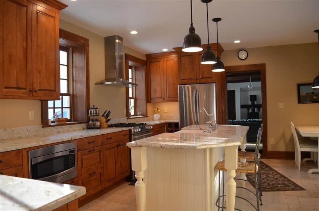 Kitchen  includes island and table for four.