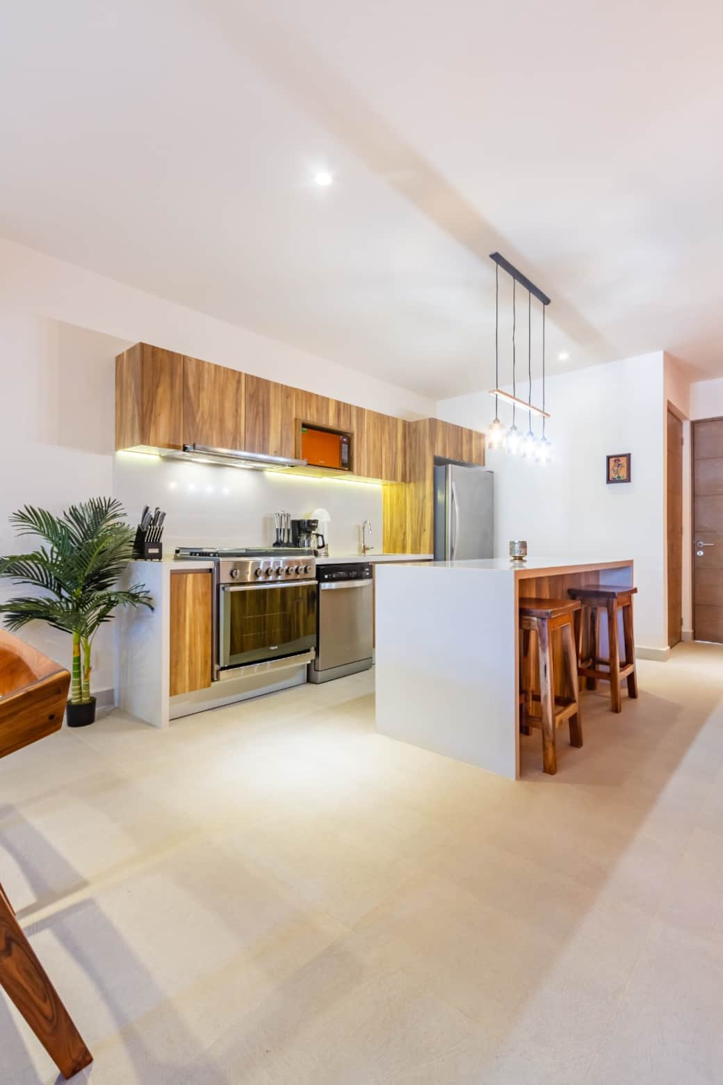 Top-notch appliances: spacious fridge, dishwasher, microwave, and a six-burner stove. 