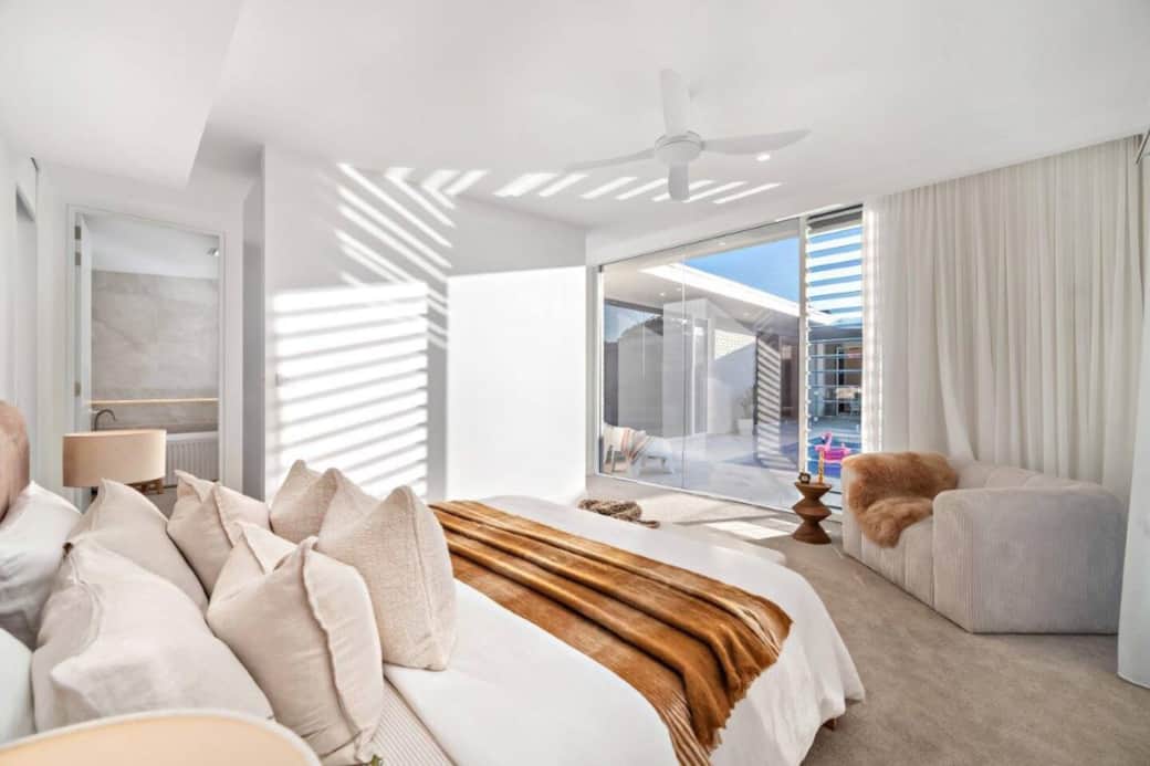 Beautiful spacious Big Master bedroom with attached ensuite and a walk in with an overview of the pool outside. 