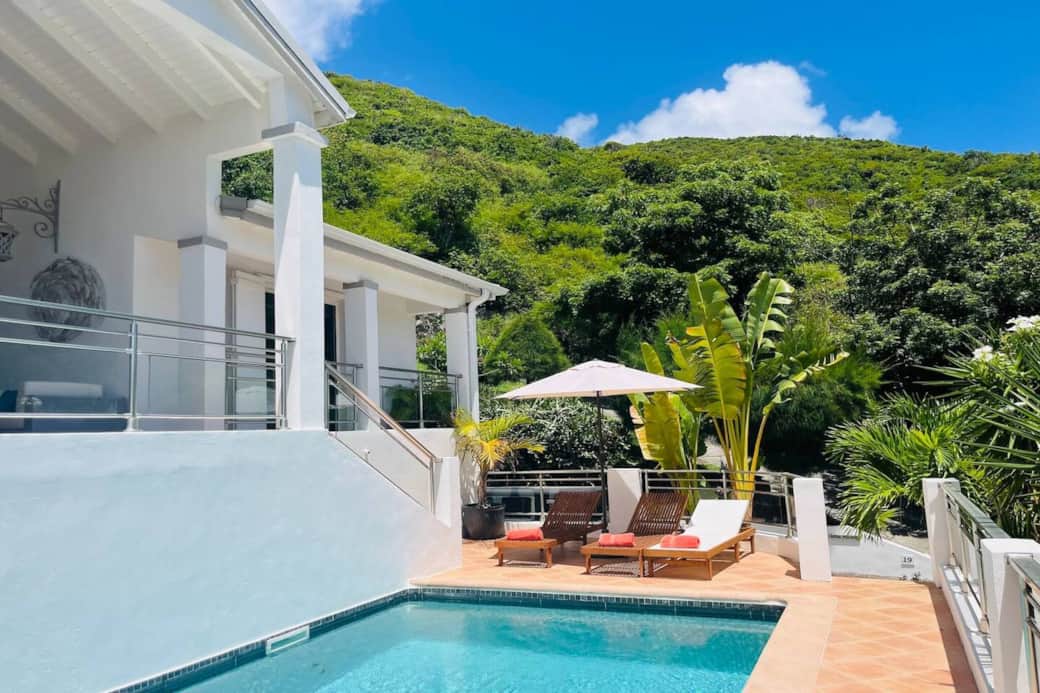 Pool with deck chairs Marina