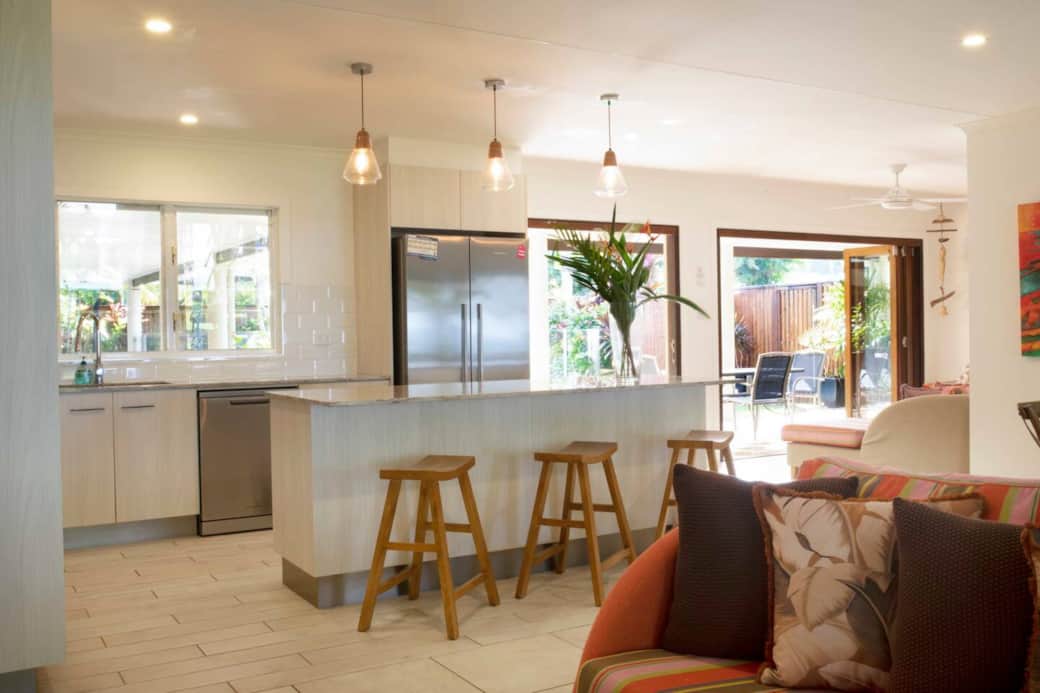 Alani - Living into kitchen area with bar stools 