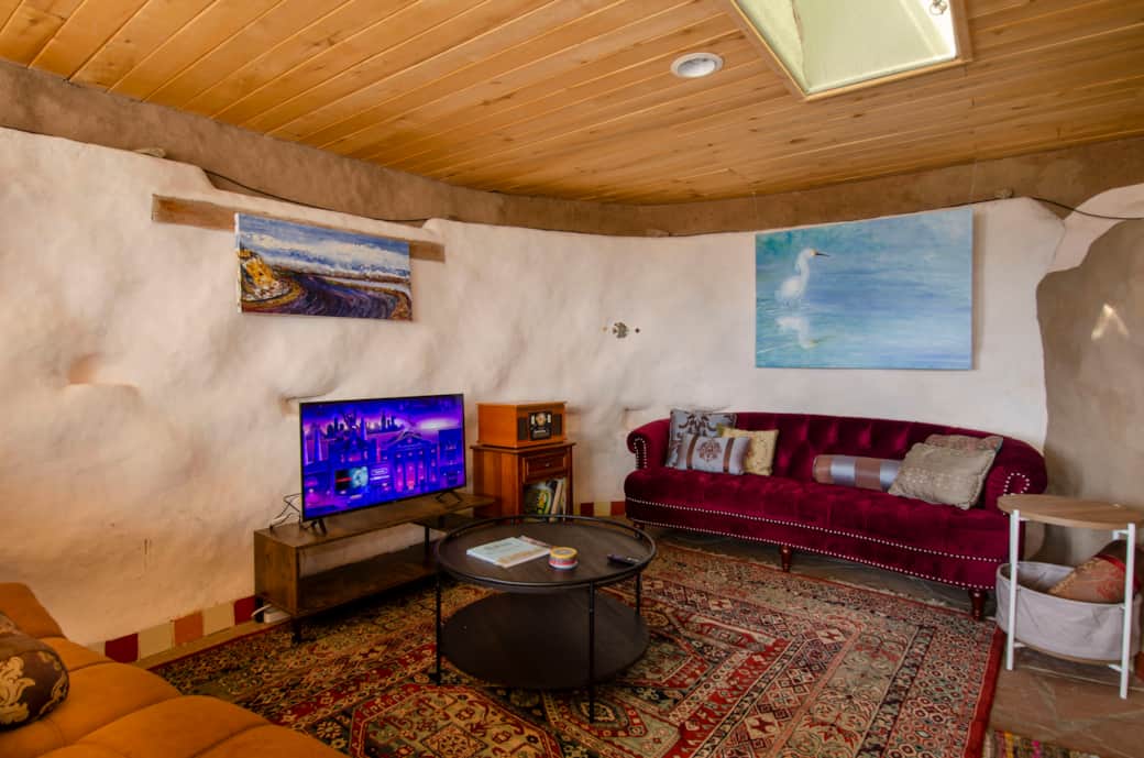 Stylish, comfortable furnishings and unique, local art complement rustic flagstone flooring Stylish, comfortable furnishings and unique, local art complement rustic flagstone flooring