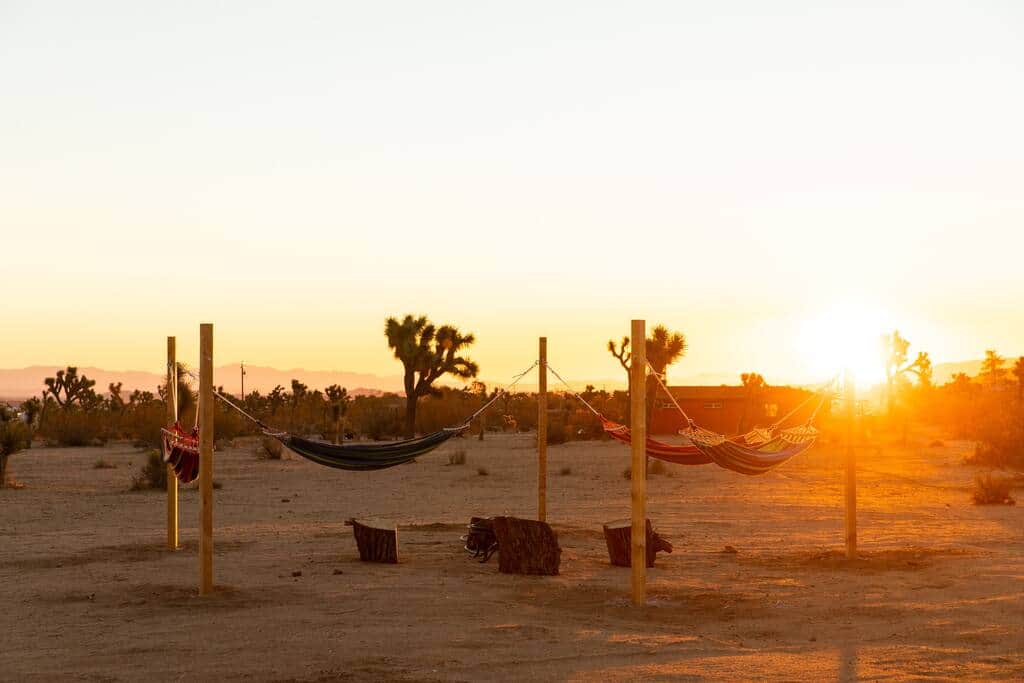 Hammocks at sunrise around the propane fire pit. 