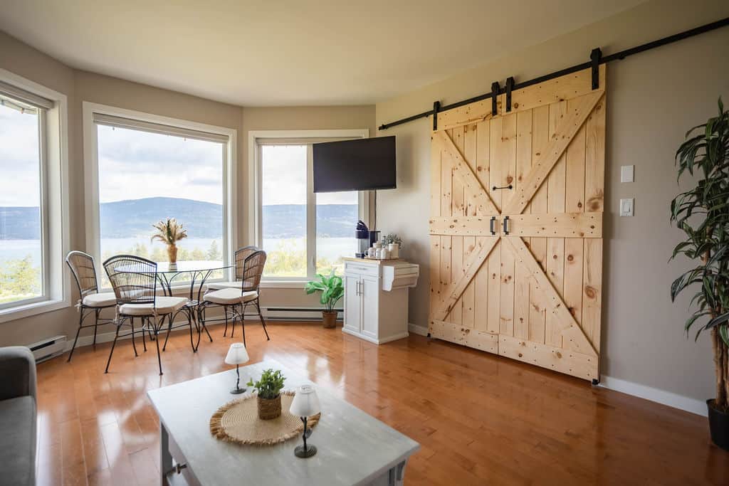 Open Concept Living Space with Signature Barn Door Feature Open Concept Living Space with Signature Barn Door Feature