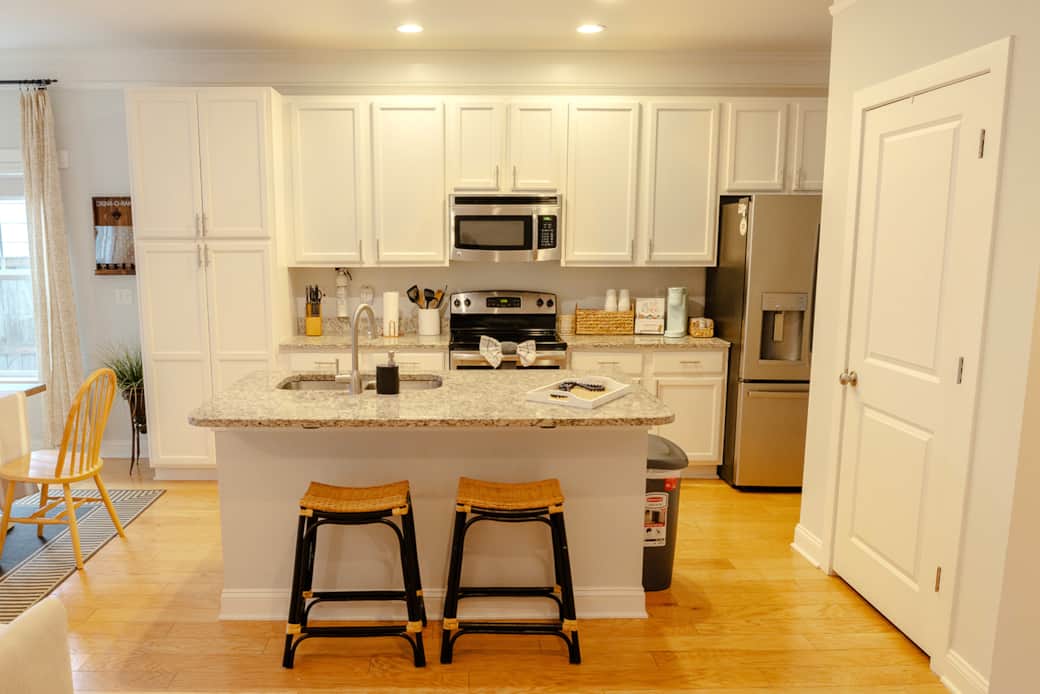 Kitchen fully stocked with appliances and cooking utensils