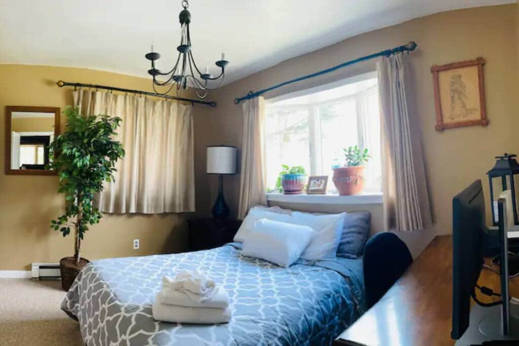 Front bedroom with Full bed, desk, nightstand, and closet with extra items Front bedroom with Full bed, desk, nightstand, and closet with extra items