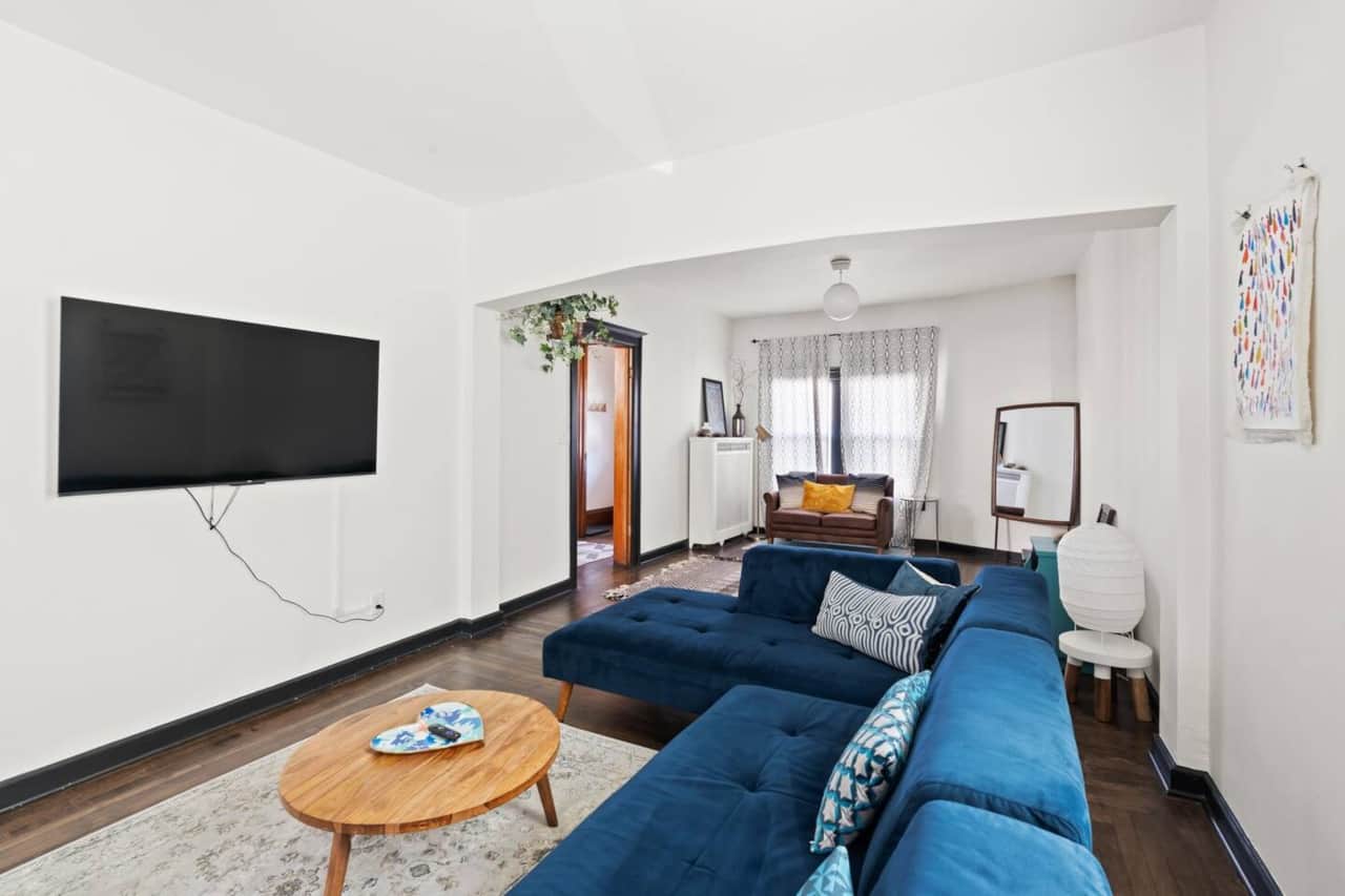 Bright and airy living space with modern décor, cozy seating, and a dedicated dining area.