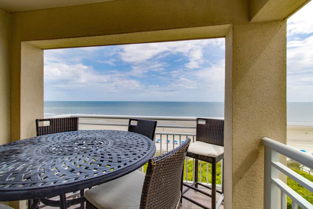 Covered Balcony with full Ocean View Table seats 6