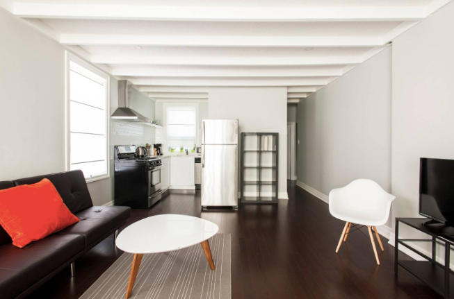 Bright Toronto furnished rental living area with modern open layout 