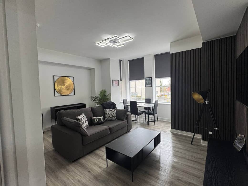 living area with sofa, dining area and smart tv