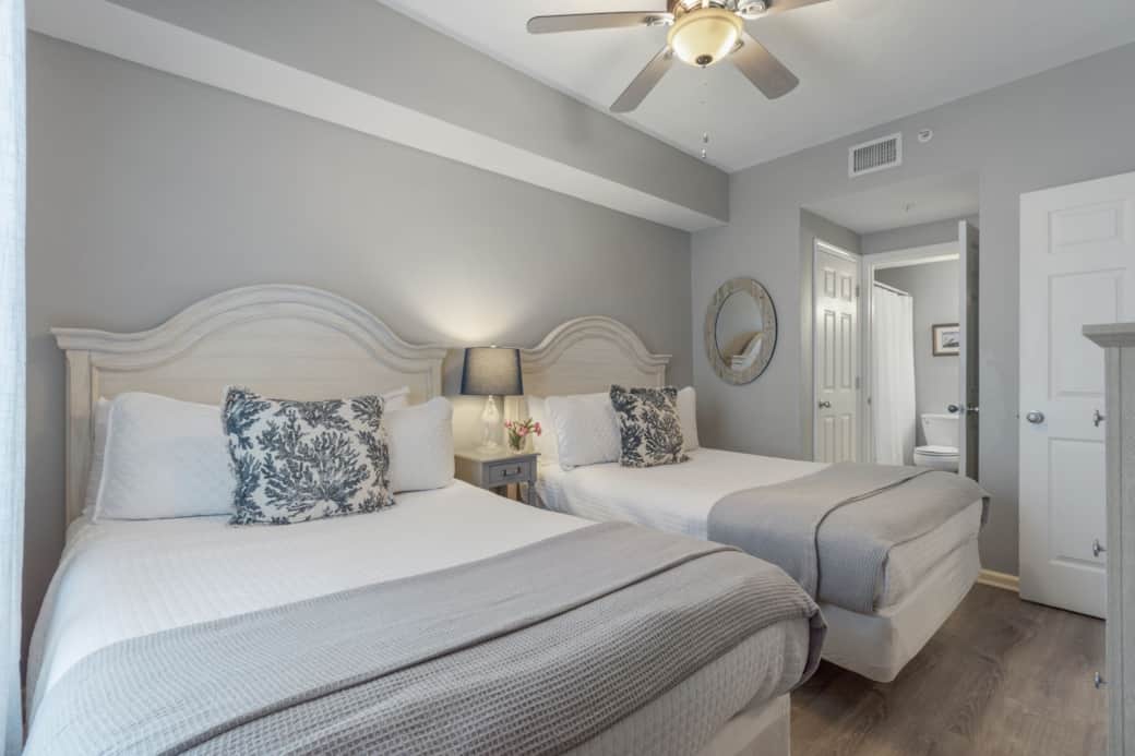 Guest room with 2 full beds & en suite—perfect for families or friends to share.