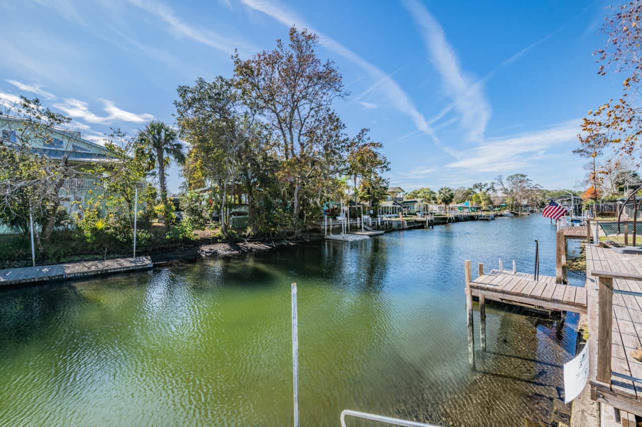 Escape to your private screened gazebo — the perfect spot to relax and enjoy bug-free water views