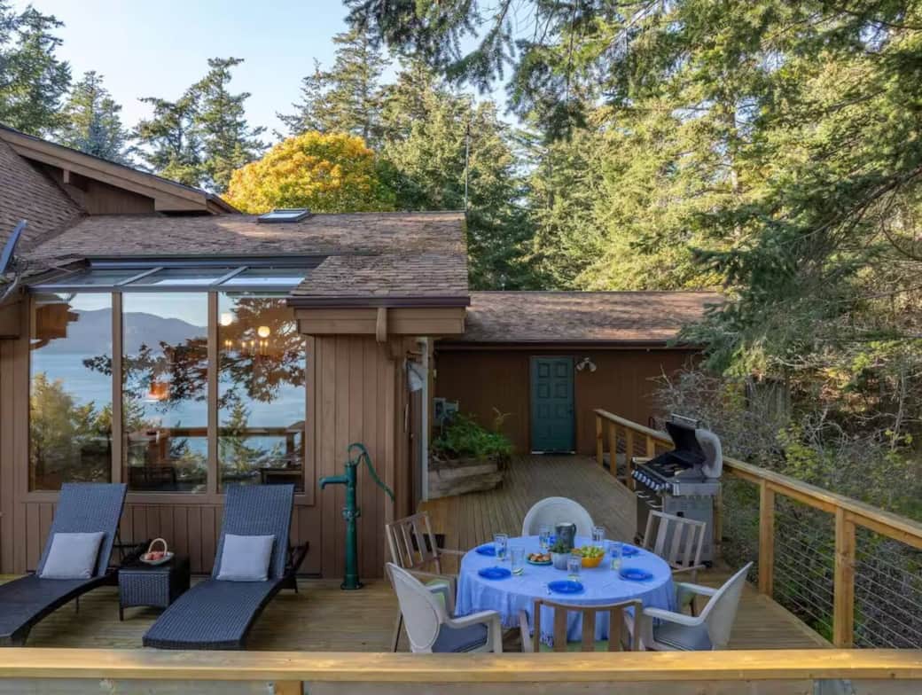 Expansive wraparound deck with forest and water views, complete with outdoor dining, lounge chairs, and a gas grill—perfect for family meals, morning coffee, or relaxing after a day of exploring Orcas Island. Expansive wraparound deck with forest and water views, complete with outdoor dining, lounge chairs, and a gas grill—perfect for family meals, morning coffee, or relaxing after a day of exploring Orcas Island.