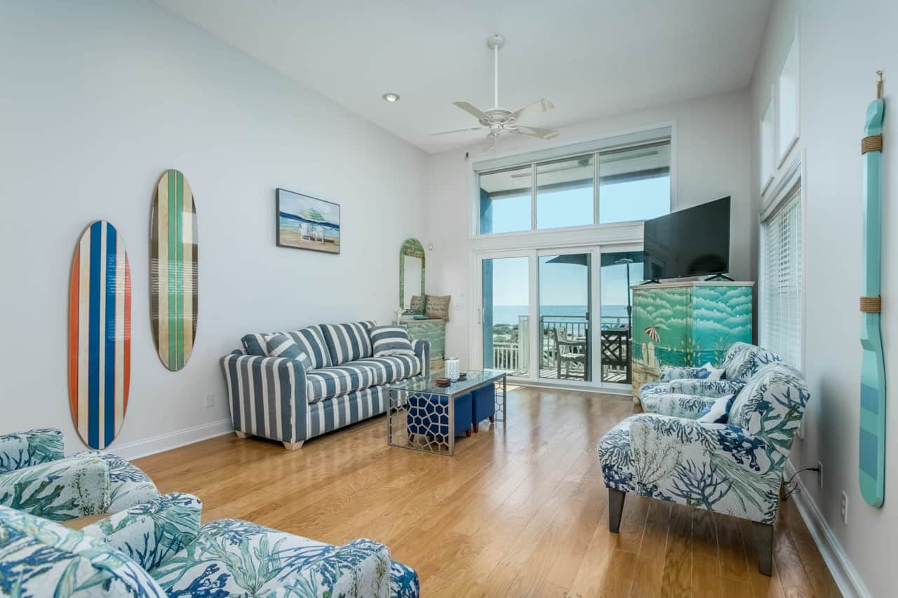 Living room, first floor,  opens to balcony dining and stair to patio on ground floor.