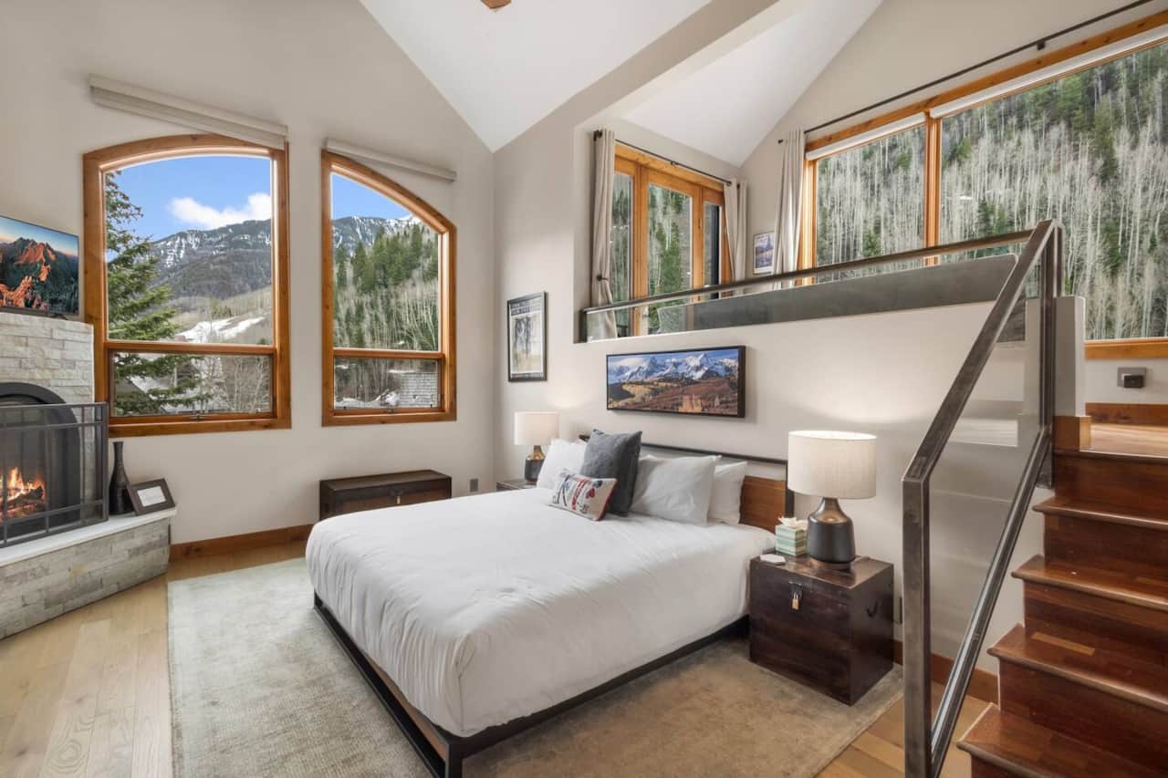 Master bedroom w King bed and fireplace
