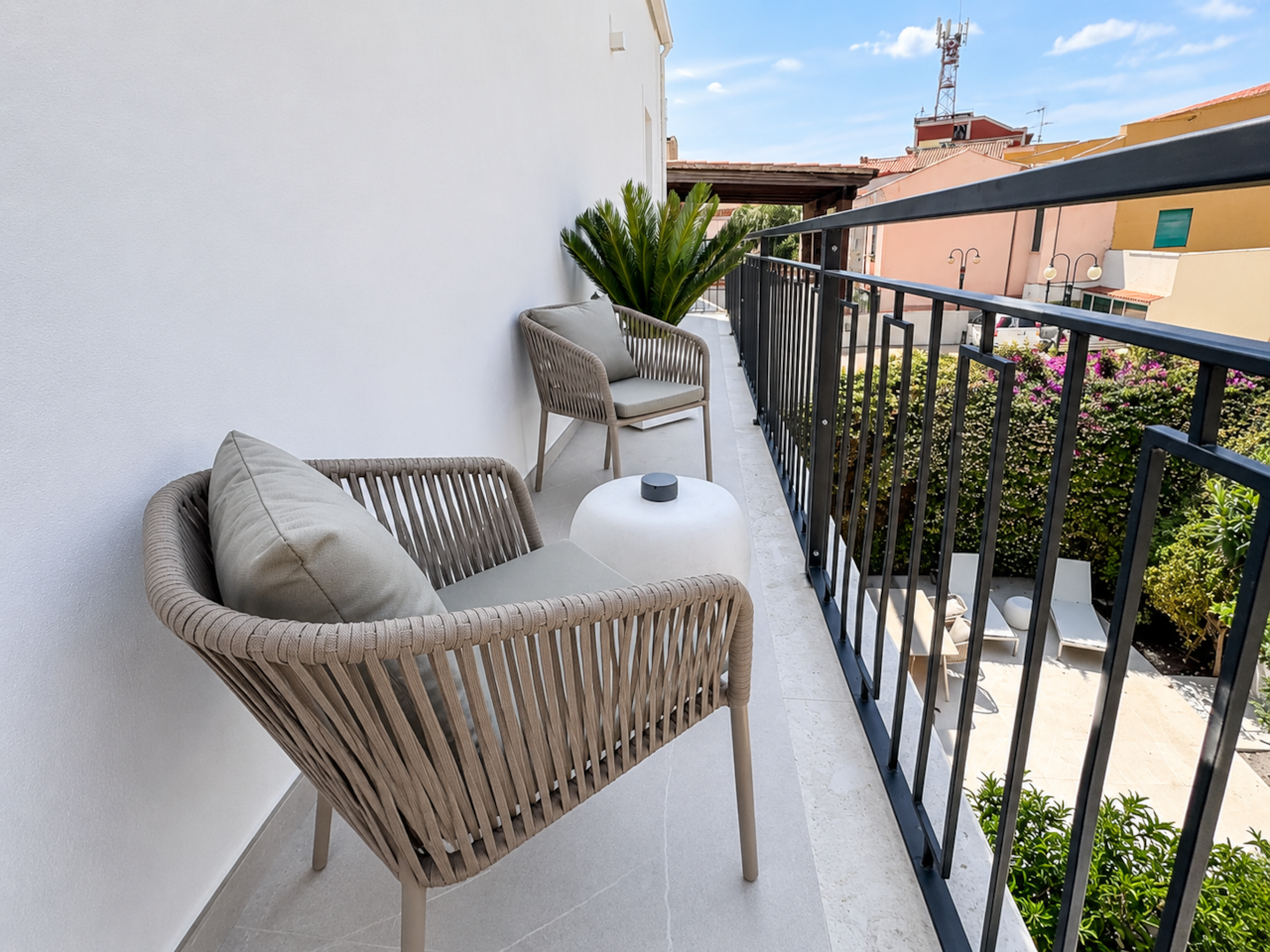 AZULIS DelleTerme Suites Private balcony with lounge chairs and town view by RENTAL12